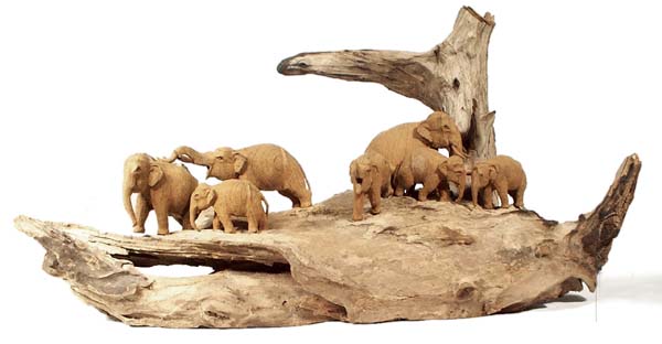 Wooden root with seven elephants